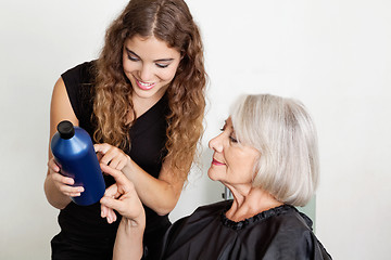 Image showing Hairdresser Advising Hair Color To Client