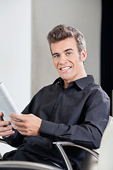 Image showing Happy Customer With Book Sitting At Hair Salon