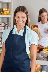 Image showing Saleswoman With Female Customer In Background