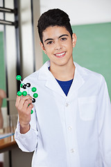 Image showing Male Student Holding Molecular Structure In Lab