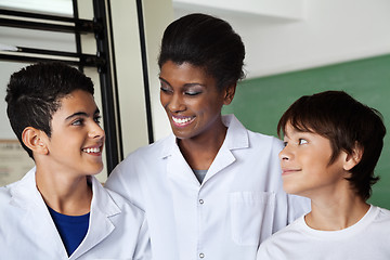 Image showing Teacher Looking At Schoolboy In Science Lab