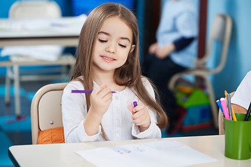 Image showing Girl Looking At Sketch Pen In Classroom