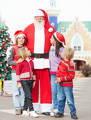 Image showing Santa Claus With Children Standing In Courtyard