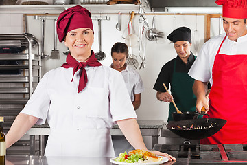 Image showing Confident Female Chef In Kitchen