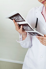 Image showing Radiologist Holding Ultrasound Print