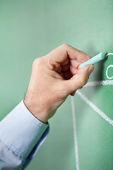 Image showing Male Professor Writing On Greenboard