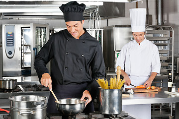 Image showing Professional Chefs Preparing Spaghetti