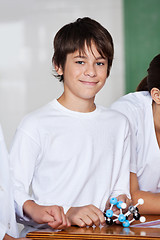 Image showing Teenage Schoolboy With Molecular Structure At Desk