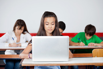 Image showing Teenage Schoolgirl Using Laptop At Desk