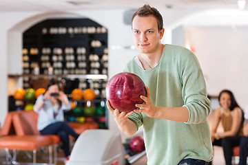 Image showing Confident Man Bowling in Club