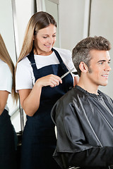 Image showing Hairstylist Giving Haircut To Client At Salon