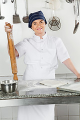 Image showing Female Chef With Rolling Pin By Kitchen Counter