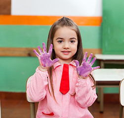 Image showing Girl Showing Colored Palms With Friends In Background