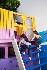 Image showing Girls Climbing Playhouse Ladder