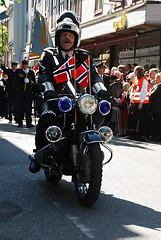 Image showing A policeman in front of the parade.