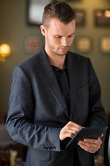 Image showing Businessman Using Digital Tablet At Cafe