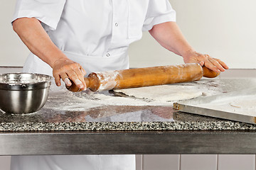 Image showing Female Chef Rolling Dough