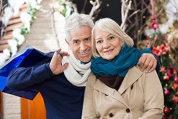 Image showing Couple With Shopping Bags At Christmas Store