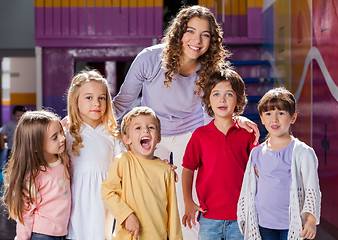 Image showing Teacher With Group Of Children In Preschool