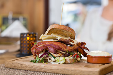Image showing Delicious Sandwich On Wooden Plate