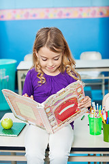 Image showing Girl Reading Book