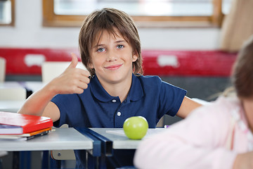 Image showing Boy Gesturing Thumbs Up In Classroom