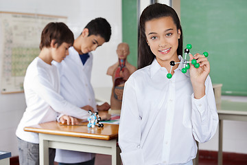 Image showing Teenage Schoolgirl Holding Molecular Structure