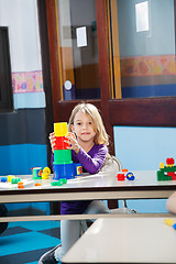 Image showing Girl Playing With Toys In Kindergarten