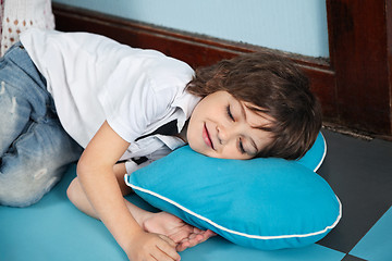 Image showing Boy Lying On Heartshaped Pillow In Kindergarten