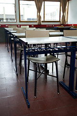 Image showing Desk And Chairs In A Row At Classroom