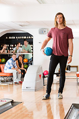 Image showing Young Man With Bowling Ball in Club