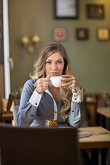 Image showing Young Woman Drinking Coffee At Cafe