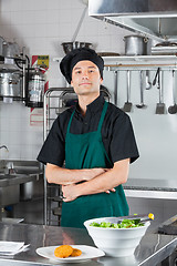 Image showing Chef With Salad And Cookie On Counter