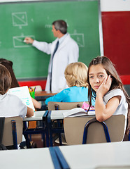 Image showing Bored Schoolgirl Sitting In Classroom