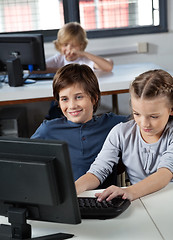 Image showing Little Boy And Girl Using Desktop Pc