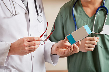 Image showing Doctor Holding Medicine Box