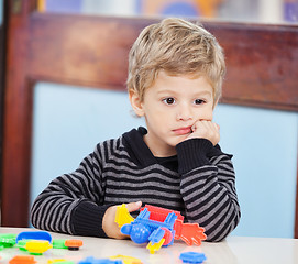 Image showing Boy With Blocks Looking Away In Preschool