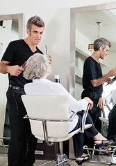 Image showing Hairdresser Attending Woman At Salon