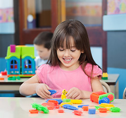 Image showing Girl Playing With Colorful Blocks In Classroom