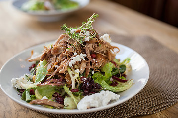 Image showing Garnished Chicken Salad At Table