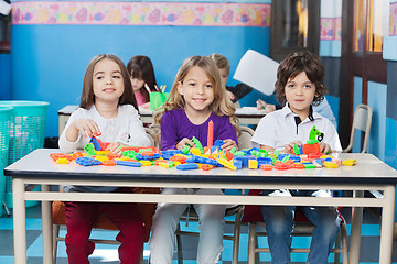 Image showing Children Playing With Construction Blocks In Kindergarten