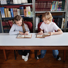 Image showing Schoolchildren Reading Book In Library