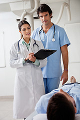 Image showing Medical Professionals With Patient At Clinic