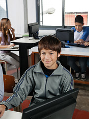 Image showing Teenage Male Student Sitting In Computer Class