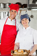 Image showing Chefs Holding Basket Full Of Breads