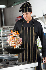 Image showing Chef Tossing Stir Fry in Wok