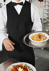 Image showing Waiter Holding Dish In Kitchen