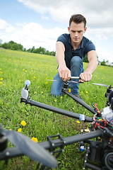 Image showing Technician Fixing Propeller Of Surveillance Drone