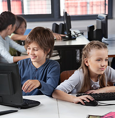 Image showing Schoolchildren Using Computer At Desk