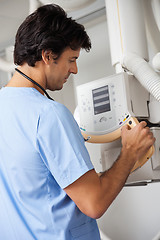 Image showing Technician Operating X-ray Machine